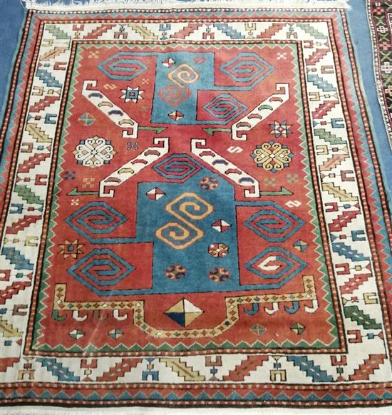 A Caucasian red ground rug 120 x 130cm